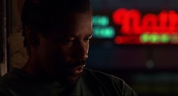 Movie still from “He Got Game” (1998), directed by Spike Lee – A man's face in the dark; Close Up shot, Low angle