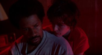 Movie still from “He Got Game” (1998), directed by Spike Lee – A man and a woman in a dark room; Close Up shot, High angle