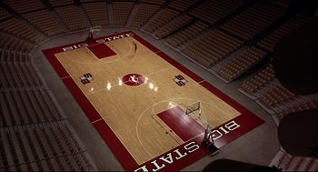 Movie still from “He Got Game” (1998), directed by Spike Lee – An empty basketball court with a basketball hoop and a net; Extreme Wide shot, Overhead angle