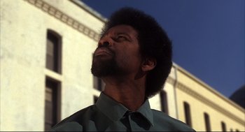 Movie still from “He Got Game” (1998), directed by Spike Lee – A person with a beard looking up; Close Up shot, Low angle