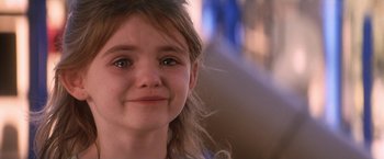 Movie still from “He's Just Not That Into You” (2009), directed by Ken Kwapis – A young girl's face with eyes wide open; Close Up shot, Over the shoulder angle