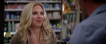 Movie still from “He's Just Not That Into You” (2009), directed by Ken Kwapis – A woman with long blonde hair standing in a store; Close Up shot, Over the shoulder angle