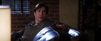 Movie still from “He's Just Not That Into You” (2009), directed by Ken Kwapis – A man holding a metal object in his hands; Medium shot, Low angle