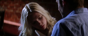 Movie still from “He's Just Not That Into You” (2009), directed by Ken Kwapis – A blonde haired woman is looking down at a man; Close Up shot, Low angle