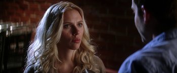 Movie still from “He's Just Not That Into You” (2009), directed by Ken Kwapis – A person with long blonde hair; Close Up shot, Over the shoulder angle