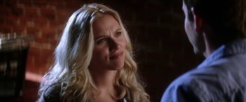 Movie still from “He's Just Not That Into You” (2009), directed by Ken Kwapis – A woman with long blonde hair is looking at the camera; Close Up shot, Over the shoulder angle
