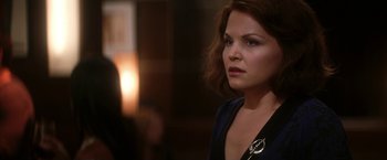 Movie still from “He's Just Not That Into You” (2009), directed by Ken Kwapis – A woman in a black top is looking to her left; Close Up shot, Over the shoulder angle