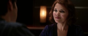 Movie still from “He's Just Not That Into You” (2009), directed by Ken Kwapis – A person sitting at a table; Close Up shot, Over the shoulder angle