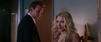 Movie still from “He's Just Not That Into You” (2009), directed by Ken Kwapis – A man and a woman standing next to each other in a room; Close Up shot, Over the shoulder angle