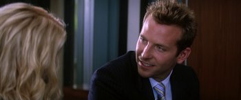 Movie still from “He's Just Not That Into You” (2009), directed by Ken Kwapis – A person wearing a suit and tie; Close Up shot, Over the shoulder angle