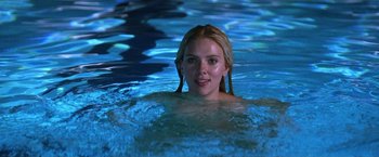 Movie still from “He's Just Not That Into You” (2009), directed by Ken Kwapis – A beautiful young lady swimming in a swimming pool; Close Up shot, Over the shoulder angle