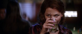 Movie still from “He's Just Not That Into You” (2009), directed by Ken Kwapis – A person holding a glass of water; Close Up shot, Over the shoulder angle