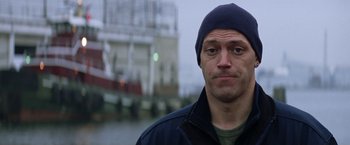 Movie still from “He's Just Not That Into You” (2009), directed by Ken Kwapis – A person wearing a jacket and a hat; Close Up shot, Low angle