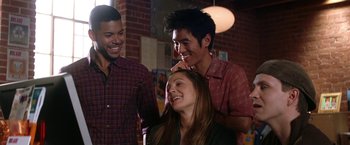 Movie still from “He's Just Not That Into You” (2009), directed by Ken Kwapis – A group of young people standing next to each other in a room; Medium shot, Over the shoulder angle