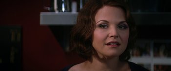 Movie still from “He's Just Not That Into You” (2009), directed by Ken Kwapis – A woman's face in a dark room; Close Up shot, Over the shoulder angle