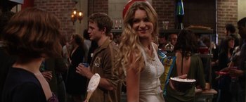 Movie still from “He's Just Not That Into You” (2009), directed by Ken Kwapis – A man and a woman standing next to each other at an event; Medium shot, Over the shoulder angle