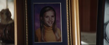 Movie still from “He's Just Not That Into You” (2009), directed by Ken Kwapis – A picture of a young girl in a yellow sweater; Extreme Close Up shot, Low angle