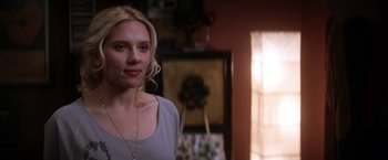 Movie still from “He's Just Not That Into You” (2009), directed by Ken Kwapis – A beautiful blonde woman standing in a room; Close Up shot, Over the shoulder angle