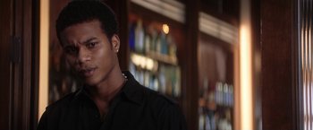 Movie still from “He's Just Not That Into You” (2009), directed by Ken Kwapis – A man in a black shirt is in front of a bar; Close Up shot, Low angle