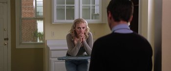 Movie still from “He's Just Not That Into You” (2009), directed by Ken Kwapis – A woman sitting in front of a man in front of a bathroom mirror; Medium shot, Over the shoulder angle