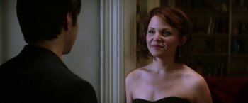 Movie still from “He's Just Not That Into You” (2009), directed by Ken Kwapis – A woman in a strapless dress looking into a mirror; Close Up shot, Over the shoulder angle