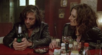 Movie still from “Head-On” (2004), directed by Fatih Akin – A man and a woman sitting at a dinner table; Medium shot, Over the shoulder angle