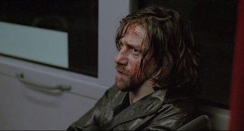 Movie still from “Head-On” (2004), directed by Fatih Akin – A person wearing a leather jacket; Close Up shot, High angle
