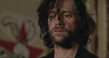 Movie still from “Head-On” (2004), directed by Fatih Akin – A person with long hair and a beard; Close Up shot, Low angle