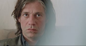 Movie still from “Head-On” (2004), directed by Fatih Akin – A person with long hair; Close Up shot, Low angle