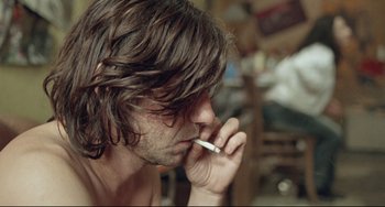 Movie still from “Head-On” (2004), directed by Fatih Akin – A person talking on a cell phone; Close Up shot, Over the shoulder angle
