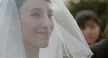 Movie still from “Head-On” (2004), directed by Fatih Akin – A woman wearing a wedding veil; Close Up shot, Over the shoulder angle