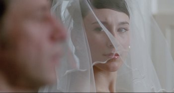 Movie still from “Head-On” (2004), directed by Fatih Akin – A person wearing a veil; Close Up shot, Over the shoulder angle