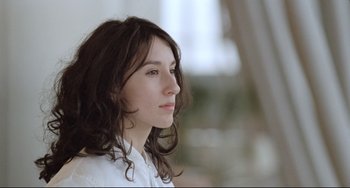 Movie still from “Head-On” (2004), directed by Fatih Akin – A person wearing a white shirt; Close Up shot, Low angle