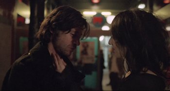 Movie still from “Head-On” (2004), directed by Fatih Akin – A man and a woman standing next to each other; Close Up shot, Over the shoulder angle