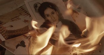 Movie still from “Head-On” (2004), directed by Fatih Akin – A picture of a woman in a fire pit; Extreme Close Up shot, High angle
