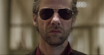 Movie still from “Head-On” (2004), directed by Fatih Akin – A person wearing sunglasses; Close Up shot, Low angle