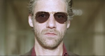 Movie still from “Head-On” (2004), directed by Fatih Akin – A person wearing sunglasses; Close Up shot, Low angle