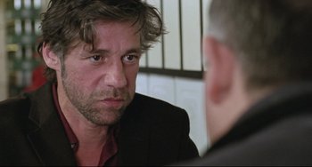 Movie still from “Head-On” (2004), directed by Fatih Akin – A person sitting in front of another person; Close Up shot, Over the shoulder angle