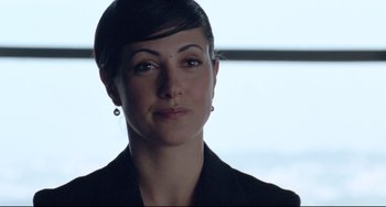 Movie still from “Head-On” (2004), directed by Fatih Akin – A person with short hair wearing a suit; Close Up shot, Over the shoulder angle