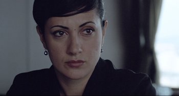 Movie still from “Head-On” (2004), directed by Fatih Akin – A person wearing a black jacket; Close Up shot, Over the shoulder angle