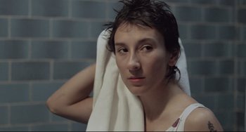 Movie still from “Head-On” (2004), directed by Fatih Akin – A woman with a towel around her neck; Close Up shot, High angle