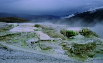 Movie still from “Heart of Glass” (1976), directed by Werner Herzog – A view of a very pretty landscape with a cloudy sky; Extreme Wide shot, High angle