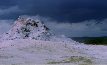 Movie still from “Heart of Glass” (1976), directed by Werner Herzog – A mountain with snow on it and dark clouds in the background; Extreme Wide shot, Low angle