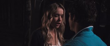 Movie still from “Tucker and Dale vs Evil” (2010), directed by Eli Craig – A man and a woman standing next to each other; Close Up shot, Over the shoulder angle