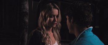 Movie still from “Tucker and Dale vs Evil” (2010), directed by Eli Craig – A man and a woman standing next to each other in a dark room; Close Up shot, Over the shoulder angle
