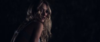 Movie still from “Tucker and Dale vs Evil” (2010), directed by Eli Craig – A beautiful young woman with long , blonde hair; Close Up shot, Low angle