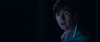 Movie still from “Tucker and Dale vs Evil” (2010), directed by Eli Craig – A person wearing a blue shirt; Close Up shot, Over the shoulder angle