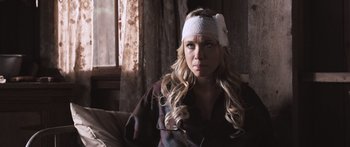 Movie still from “Tucker and Dale vs Evil” (2010), directed by Eli Craig – A woman with a bandage on her head; Close Up shot, Over the shoulder angle