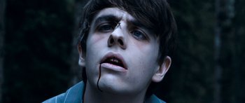 Movie still from “Tucker and Dale vs Evil” (2010), directed by Eli Craig – A young man with blood dripping from his face; Close Up shot, High angle