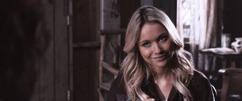 Movie still from “Tucker and Dale vs Evil” (2010), directed by Eli Craig – A beautiful blonde woman with long blonde hair; Close Up shot, Over the shoulder angle